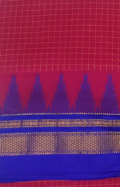 Pink checkered Gadwal mercerised cotton saree with contrasting royal blue temple border and pallu.