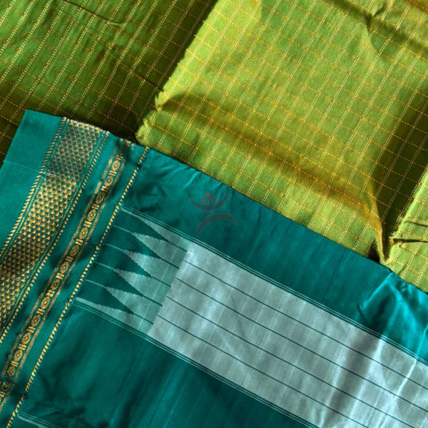 Green checkered Gadwal mercerised cotton saree with contrasting teal temple border and pallu.