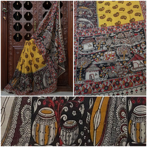 Yellow Chennur silk kalamkari with intricate village scene on pallu and paisley motif on all over the body.