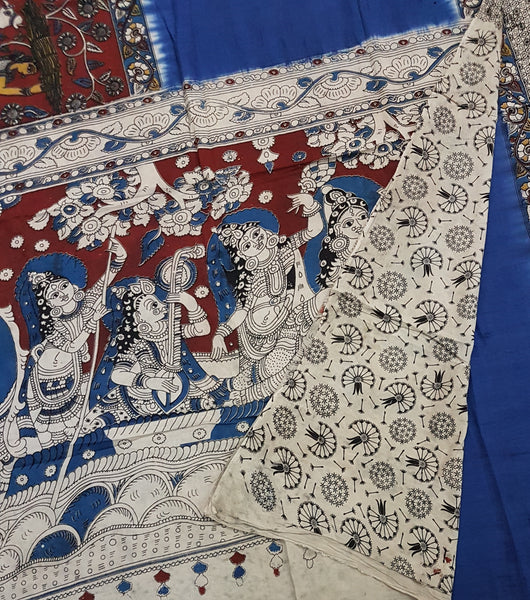 Blue and maroon half and half mul cotton kalamkari saree with peacock and human figure motifs.