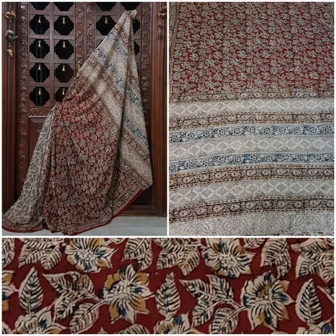 Mul cotton kalamkari half and half saree with contrasting maroon and off white colour combination. The saree has floral motif all over the saree.