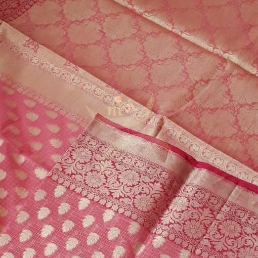 Pink silk cotton benaras brocade with fuschia pink border, antique zari  butties on body, pallu and border. The saree comes with brocade blouse piece.
