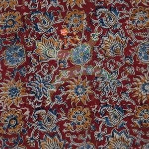 Red handloom cotton kalamkari fabric with floral motifs