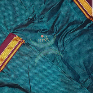Teal blue Khun/khana running material with maroon border. Width of the fabric is 36. inches.