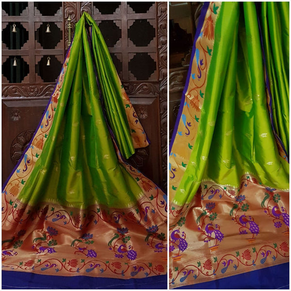 Green paithani with traditional peacock motif and contrast blue pallu and border.