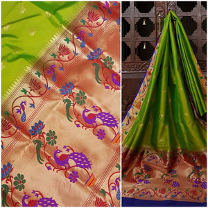 Green paithani with traditional peacock motif and contrast blue pallu and border.