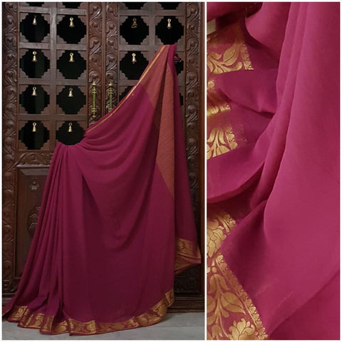 Bright mejanta crepe art silk with zari border.