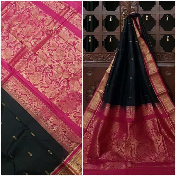 Black and pink handwoven kanjivaram with Traditionally woven floral pallu and border.saree is with floral booties all over body.