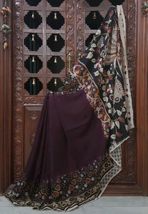 Brown chennur silk kalamkari with intricate peacock motif on pallu and leaf motif on border.