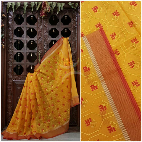 Yellow kota cotton with all over embroidery and contrasting red border
