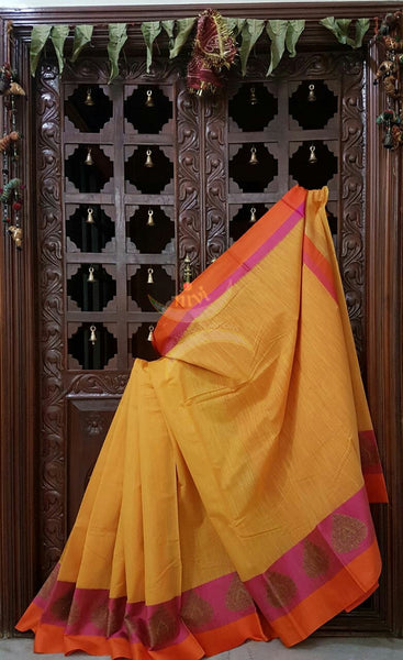 Yellow mercerised cotton saree with satin finish contrasting pink and orange border and pallu