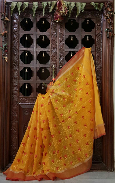 Yellow kota cotton with all over embroidery and contrasting red border