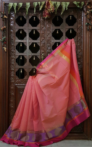 Peach benaras cotton mercerised saree with satin finish contrasting pallu and border and antique gold zari woven on border