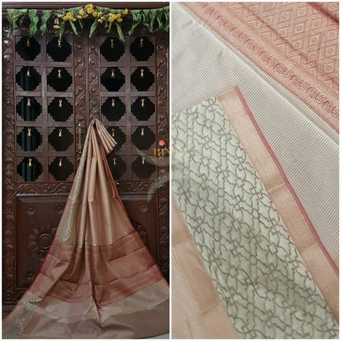 Off white with pink stripes silk cotton saree with woven brocade pallu and border. The saree comes with contrasting striped blouse