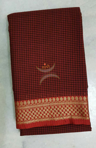Kota cotton checks with traditional border and pallu. Saree comes with running blouse