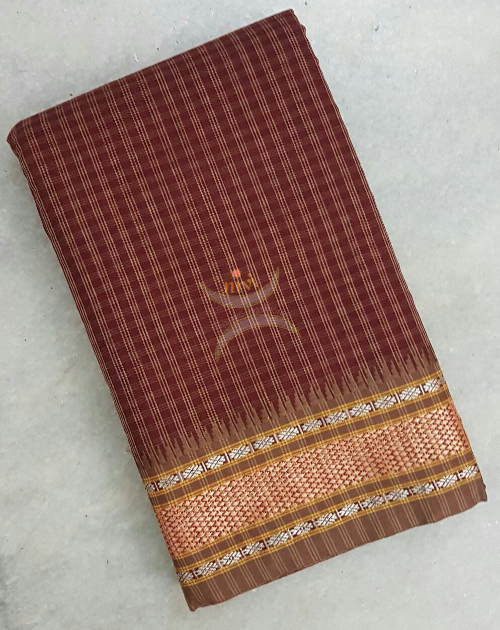 Kota cotton checks with traditional border and pallu. Saree comes with running blouse