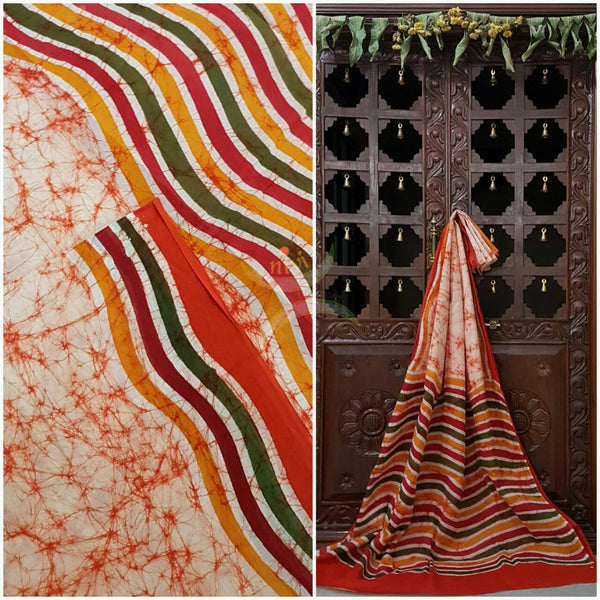 Orange handloom Mul Cotton Batik saree with wavy motif on contrasting red border and pallu