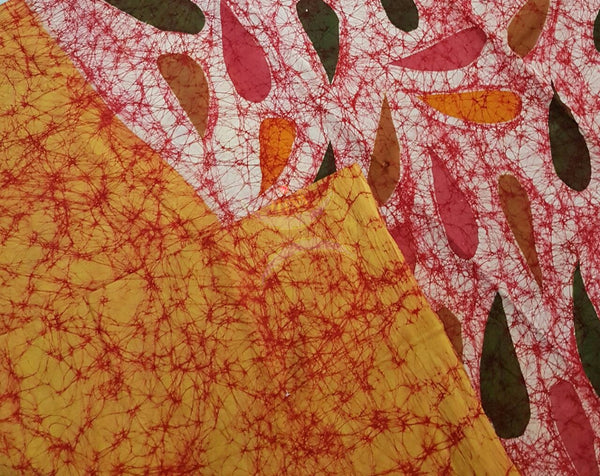 Orange handloom Mul Cotton Batik saree with contrasting abstract motif red border and pallu