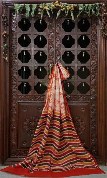 Orange handloom Mul Cotton Batik saree with wavy motif on contrasting red border and pallu