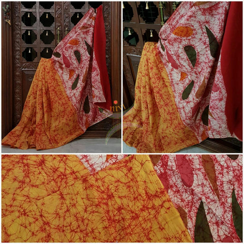 Orange handloom Mul Cotton Batik saree with contrasting abstract motif red border and pallu