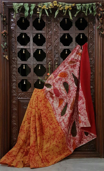 Orange handloom Mul Cotton Batik saree with contrasting abstract motif red border and pallu