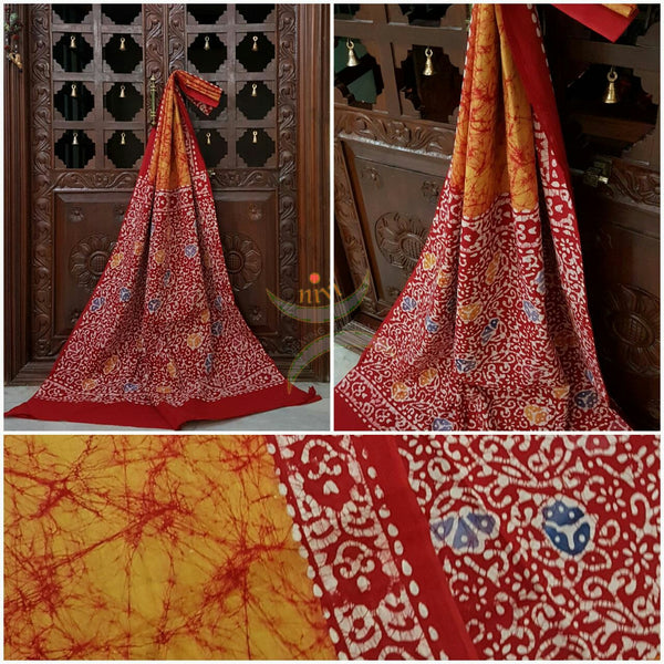 Orange handloom Mul Cotton Batik saree with contrasting floral motif red border and pallu