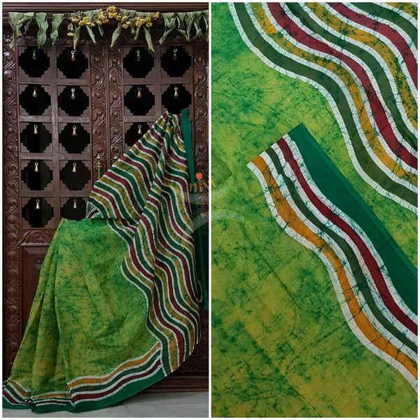 Green handloom Mul Cotton Batik saree with contrasting wavy motif on border and pallu
