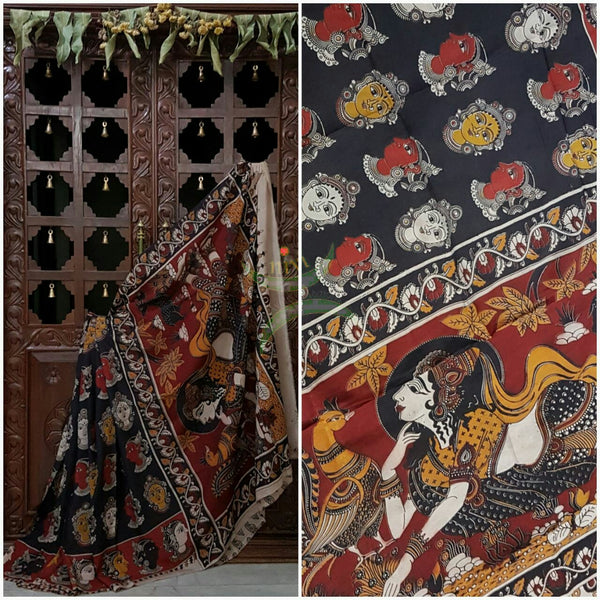 Black Chennur silk kalamkari with kathakali faces on body and border and lady figure on the pallu.