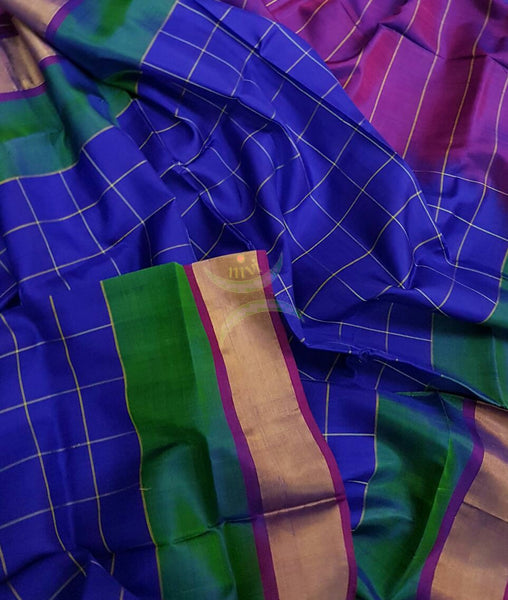 Royal blue chequered pure silk uppada with combination of green and tissue border and contrasting purple pallu and blouse