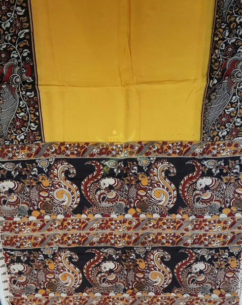 Yellow dye on dye chennur silk kalamkari with peacock motif on border and pallu.
