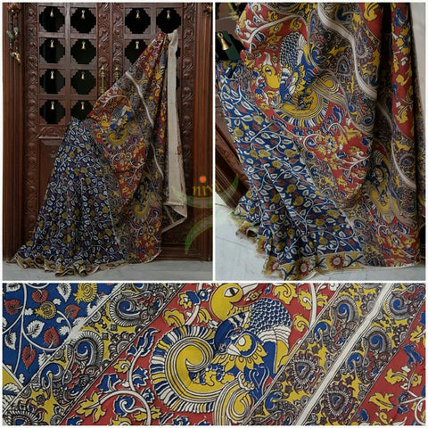 Blue chennur silk kalamkari with all over floral motif on body and border and intricate peacock motif on pallu.