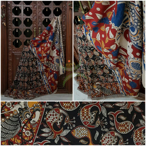 Black Chennur silk kalamkari with fish motif on body and peacock motif on border and pallu.