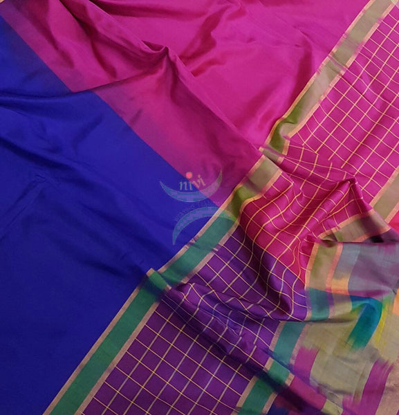 Royal blue handloom pure silk uppada with contrasting pink pallu and blouse and combination of checks and pochampalli border