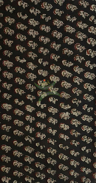 Black handwoven cotton kalamkari material with floral motifs.