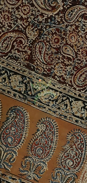 Maroon mustard handwoven cotton kalamkari material with Paisley motifs.