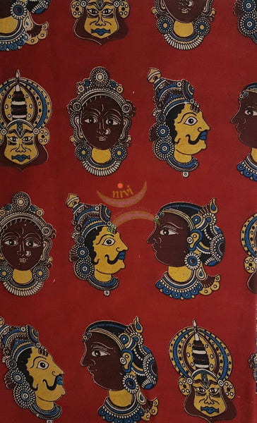 Red handwoven cotton kalamkari material with Kathakali face motifs.
