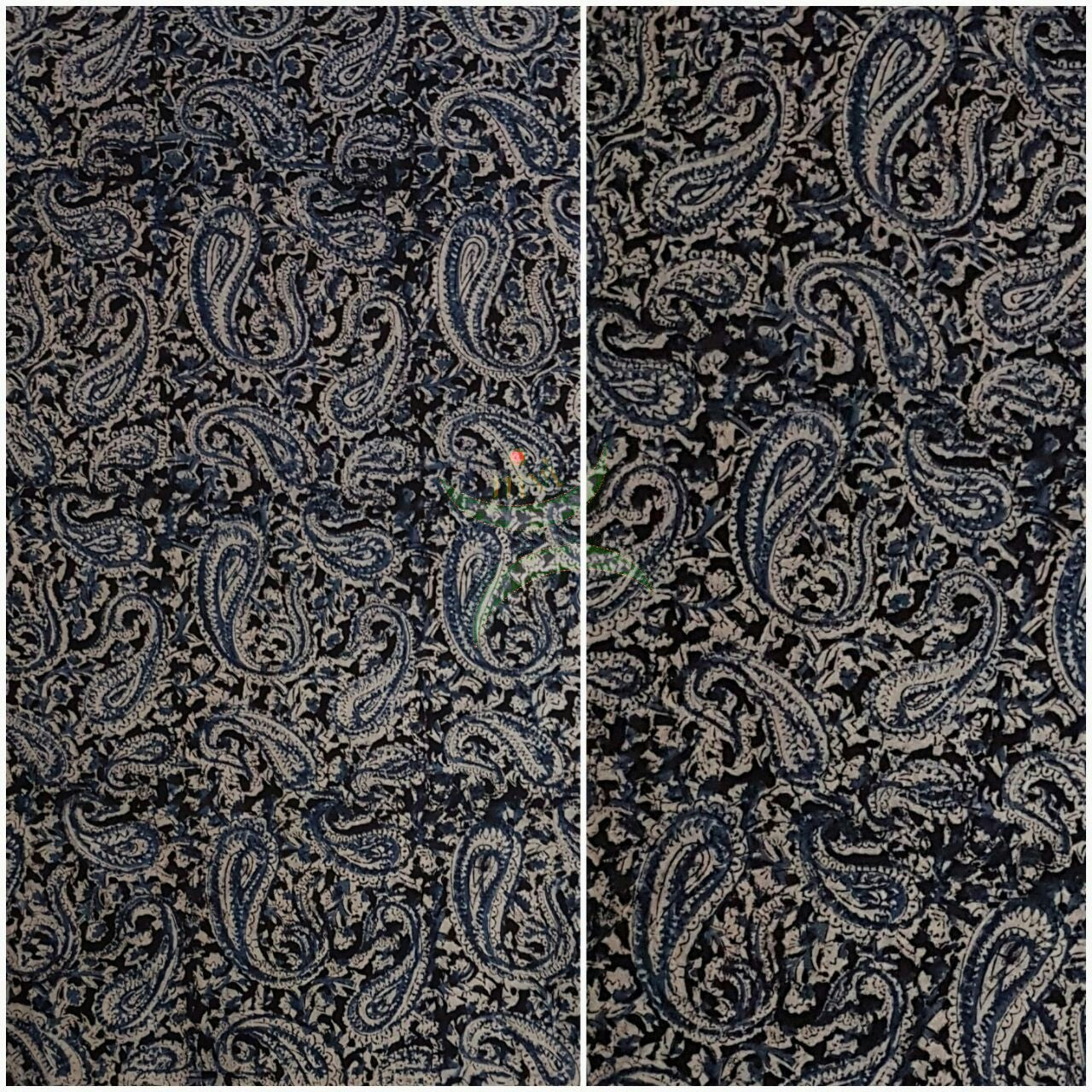 Black handwoven cotton kalamkari material with Paisley motifs.
