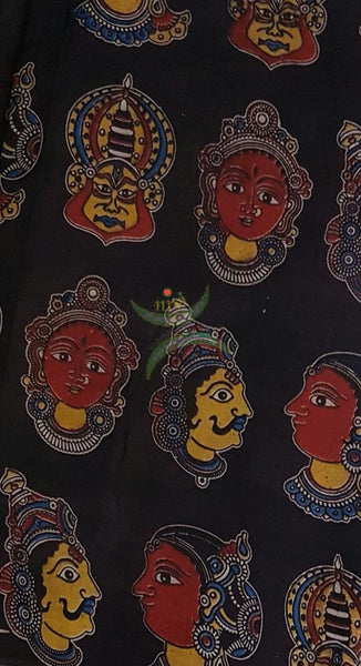 Black handwoven cotton kalamkari material with Kathakali face motifs.