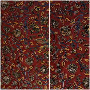 Red handwoven cotton kalamkari material with floral motifs.