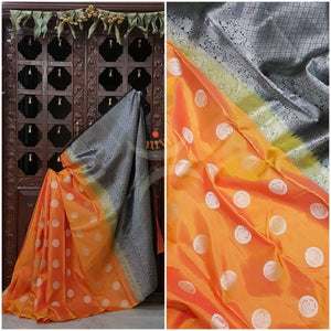 Orange handloom kanjeevaram pure silk saree with black contrasting brocade woven pallu and blouse. Silk mark certified!