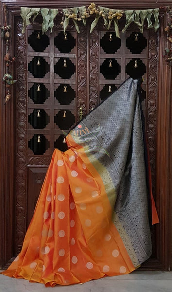 Orange handloom kanjeevaram pure silk saree with black contrasting brocade woven pallu and blouse. Silk mark certified!
