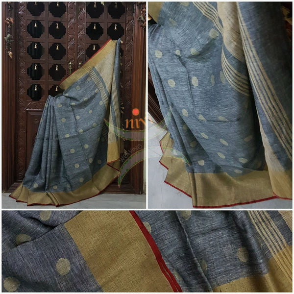 Grey with gold Handloom 100s count Linen saree with woven booties all over the saree and gold pallu.