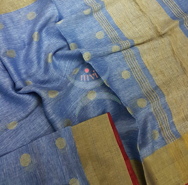 Blue with gold Handloom 100s count Linen saree with woven booties all over the saree and gold pallu.