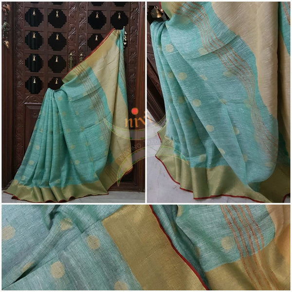 Sea green with gold Handloom 100s count Linen saree with woven booties all over the saree and gold pallu.