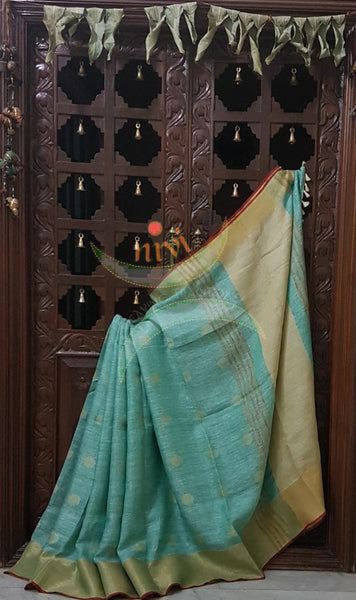 Sea green with gold Handloom 100s count Linen saree with woven booties all over the saree and gold pallu.