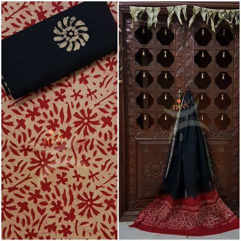 Maroon with black Batik printed three piece pure merserised cotton suit. Dress material is printed with abstract floral motif.