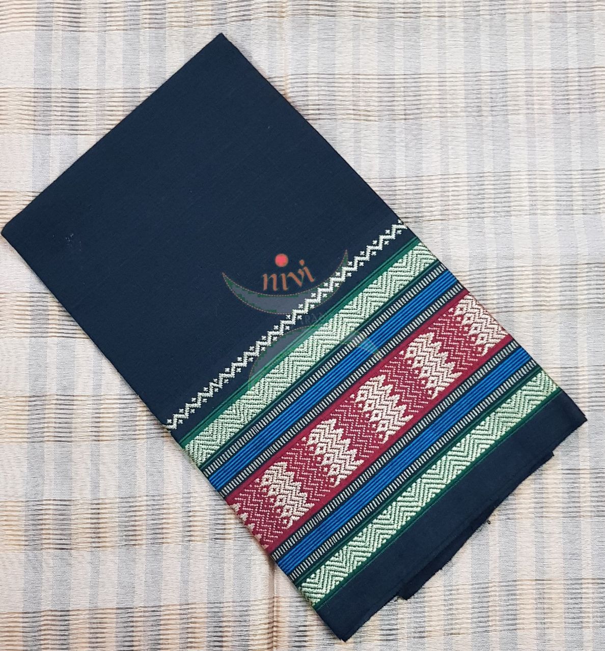 Black with green Mangalgiri pure cotton blouse piece with traditional woven border. The blouse comes with 42 inches by  width and length up to 1mt.