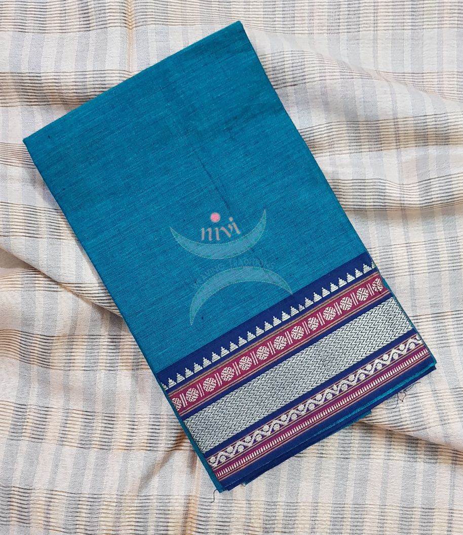 Teal with navy blue Mangalgiri pure cotton blouse piece with traditional woven border. The blouse comes with 42 inches by  width and length up to 1mt.