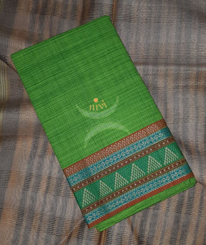 Green with brown Mangalgiri pure cotton blouse piece with traditional woven border. The blouse piece comes with 42 inches by width and length up to 1mt.