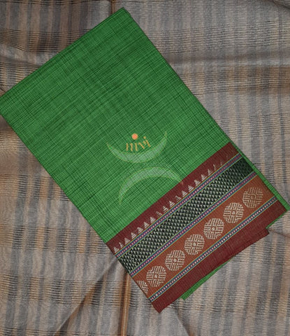 Green with brown Mangalgiri pure cotton blouse piece with traditional woven border. The blouse piece comes with 42 inches by width and length up to 1mt.